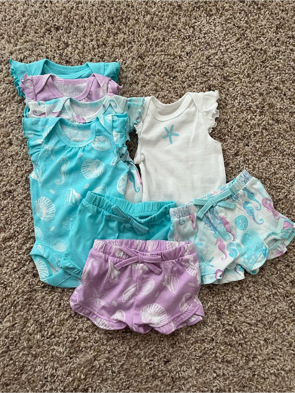 The Children’s Place Newborn 5 Bodysuits & 3 Shorts Set in Pastel Seashell Print